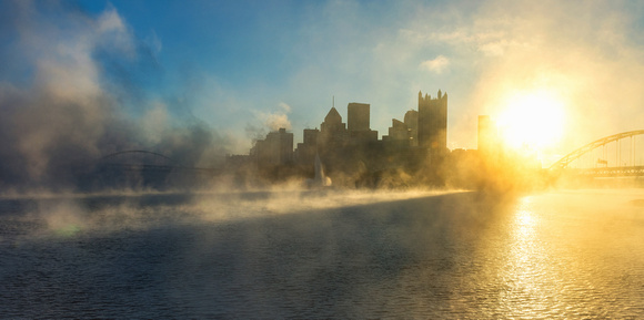 Morning fog glows on the Allegheny River