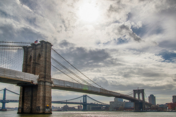 The sun over the Brooklyn Bridge in New York City
