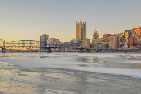 Pittsburgh skyline on the ice covered Monongahela River in the winter