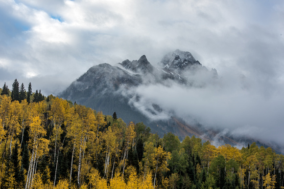 Morning fog over Mt. Sneffels in the fall in Colorad