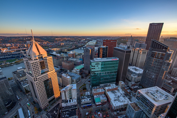 The Highmark Building is lit up at dawn in this rooftop view in Pittsburgh
