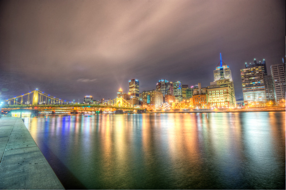 Bright Pittsburgh skyline and reflections from the North Shore at night HDR