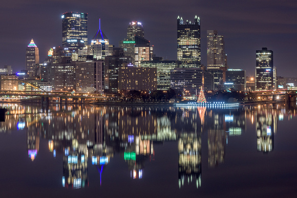 A reflection of the Pittsburgh skyline just before sunrise