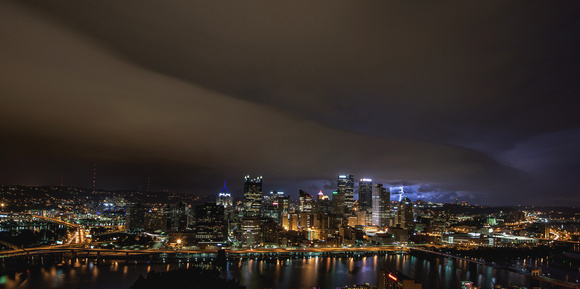 A storm front moves over Pittsburgh as lightning strikes during a summer storm