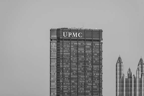 A black and white view of the top of the Steel Building and PPG Place in Pittsburgh