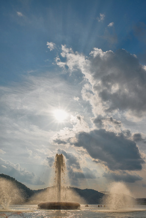 The sun sets against the fountain at Point State Park in Pittsburgh