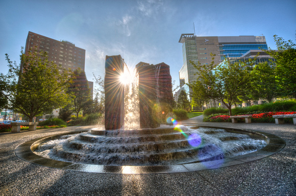 Sunflare through a fountain in downtown Pittsburgh HDR