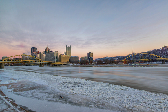 Pink sky over Pittsburgh as ice rushes down the Allegheny River