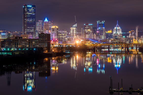 Pittsburgh glows at night from the 31st Street Bridge