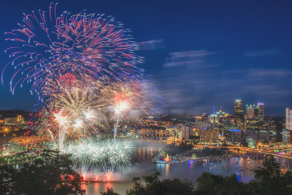 Flashes of fireworks in the sky over Pittsburgh on July 4th, 2014