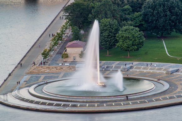 People relax by the fountain at Point State Park in Pittsburgh