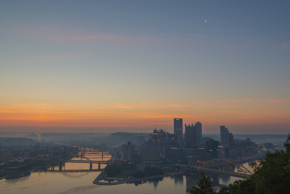 Soft colors above the Pittsburgh skyline at dawn