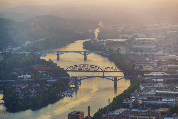 The Allegheny River glows at sunrise in Pittsburgh