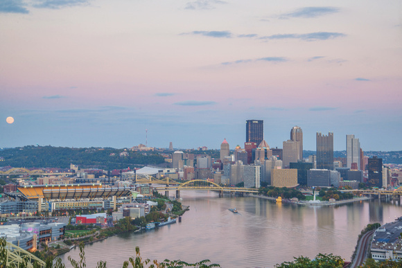 A colorful sky during sunset over Pittsburgh from the West End Overlook and the Giant Rubber Duck
