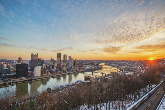 Sun just crests the horizon in Pittsburgh on a beautiful morning from Mt. Washington