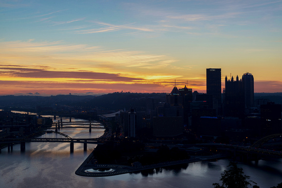 Pittsburgh skyline silhouetted at dawn