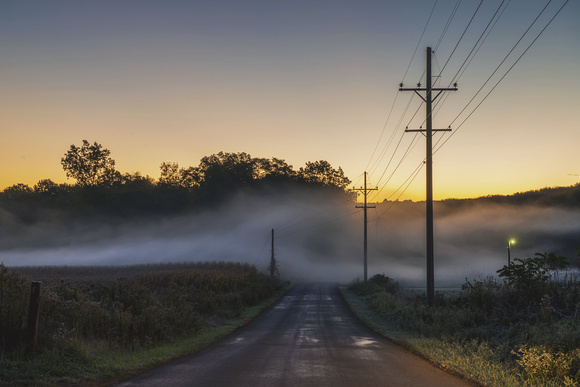 A foggy road in Portersville in the fall