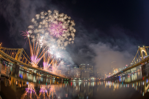 Fireworks over the water on Light Up Night in Pittsburgh