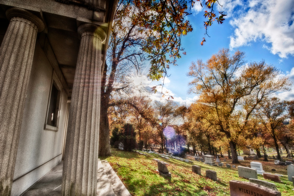 Sunflare by a mausoleum at Allegheny Cemetery HDR