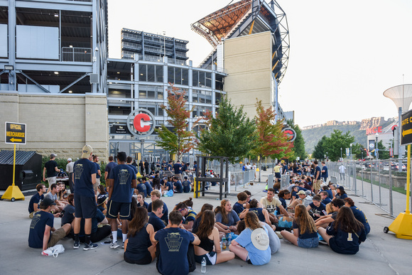 Students wait outside Heinz Field before the Pitt vs. Penn State game