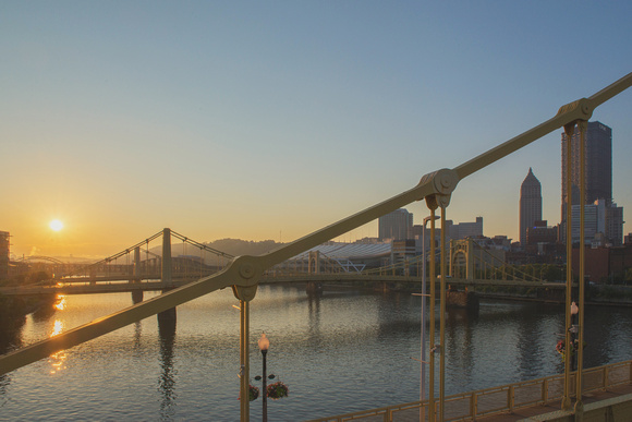 A view of sunrise from the Roberto Clemente Bridge in Pittsburgh