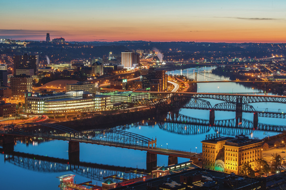 The Monongahela River glows before dawn in Pittsburgh