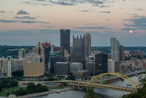 The supermoon peeks out behind clouds over Pittsburgh