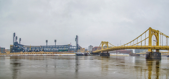 PNC Park and Roberto Clemente Bridge panorama in the snow in Pittsburgh