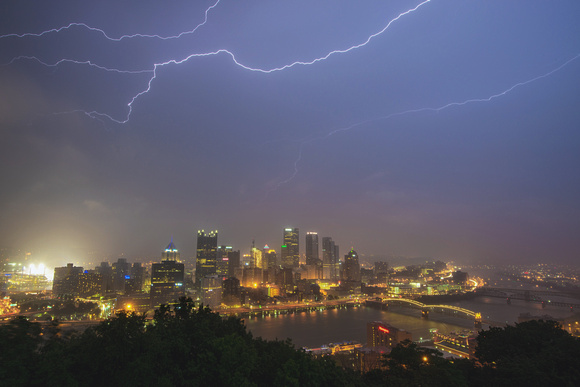 Lightning bolts streak through the sky over Pittsburgh