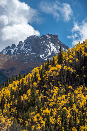 Mountains rise over fall colors in Colorado