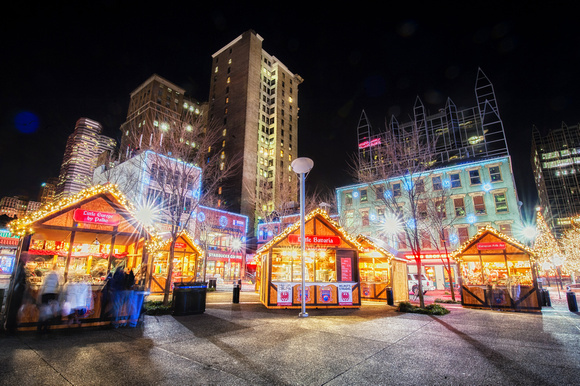 Pittsburgh rises above the holiday market in Market Square in Pittsburgh at Christmas