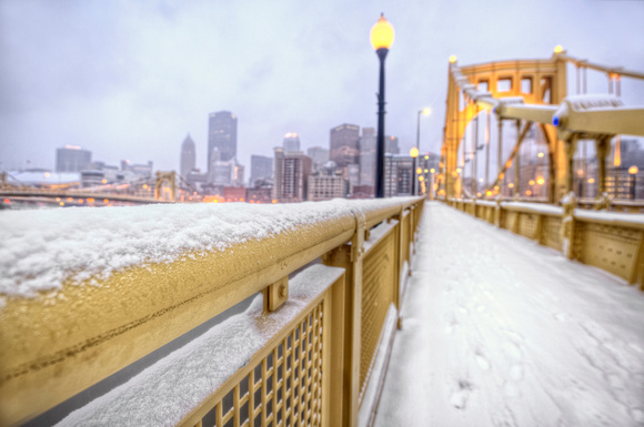 Snowy railing on the Roberto Clemente Bridge HDR