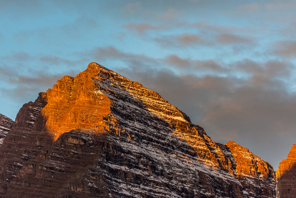 Maroon Peak is lit up by the rising sun at dawn