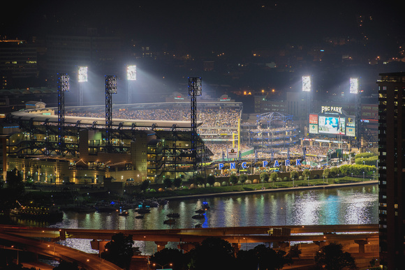 PNC Park lit up during a night game in Pittsburgh