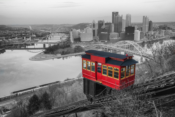 A selective coloring of a trolley climbing Mt. Washington in the winter in Pittsburgh