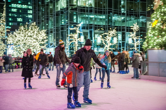 Skaters on the ice at PPG Place on Light Up NIght In Pittsburgh