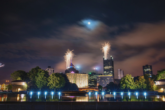 Fireworks and the moon over downtown Pittsburgh from Point State Park