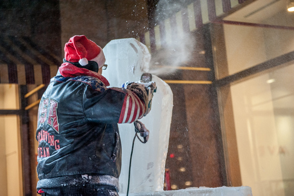 An ice carver in Pittsburgh during Light Up NIght
