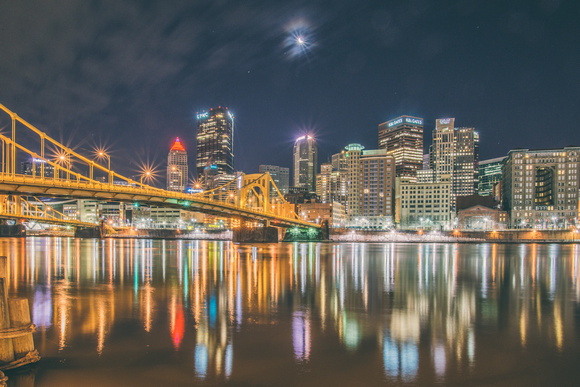 A moonflare over the Pittsburgh skyline and Andy Warhol Bridge