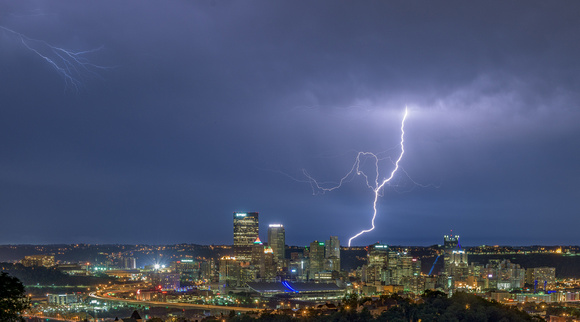 A jagged lightning bolt strikes behind Pittsburgh