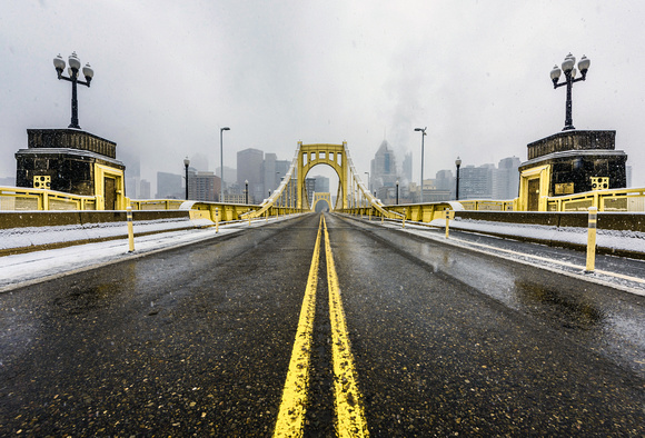 A view down the Clemente Bridge in the snow in Pittsburgh