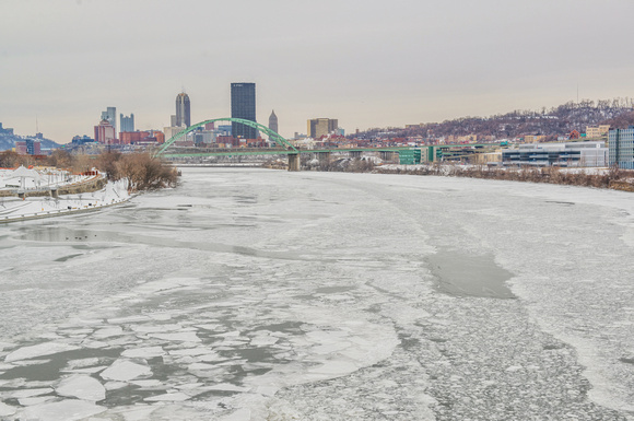 Up the icy Monongahela River with the Pittsburgh skyline for the Hot Metal Street Bridge