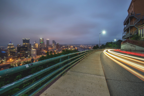 Light trails on PJ McCardle Roadway on a cloudy morning in Pittsburgh