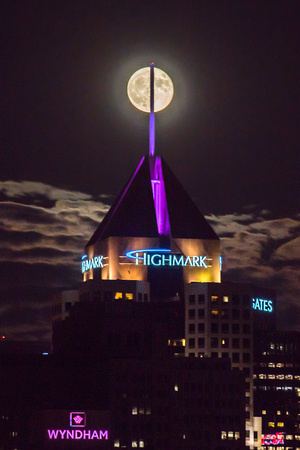 The Highmark Building bisects the full moon over Pittsburgh