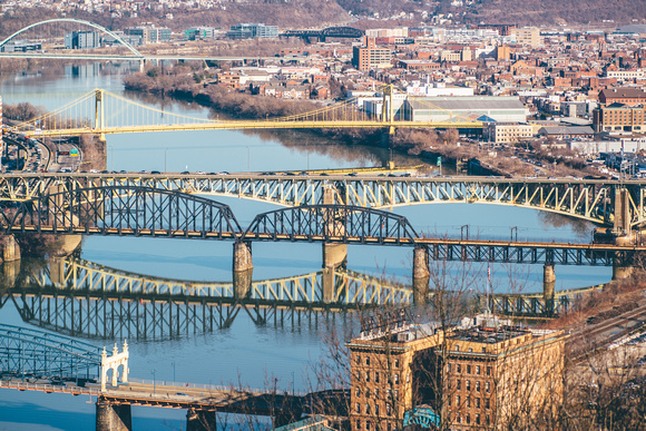 Bridges reflect in the Monongahela River in Pittsburgh