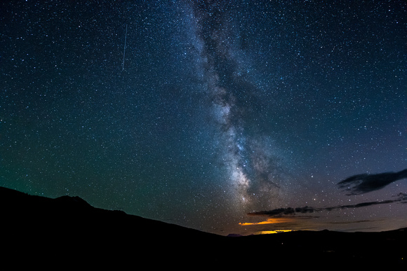 Shooting stars and the Milky Way shine over McClure Pass in Colorado